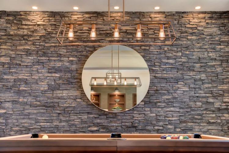 ES_Black-River_Stacked-Stone_Int_Game-Room_Accent-Wall_2-1-1-scaled-e1621611561681