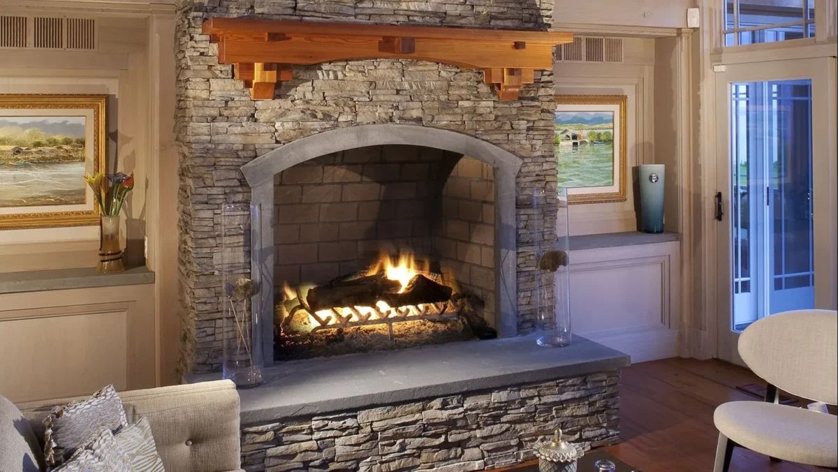 ES_Stacked-Stone_Nantucket_Int_Carr-Residence_fireplace-with-art-e1487892157296